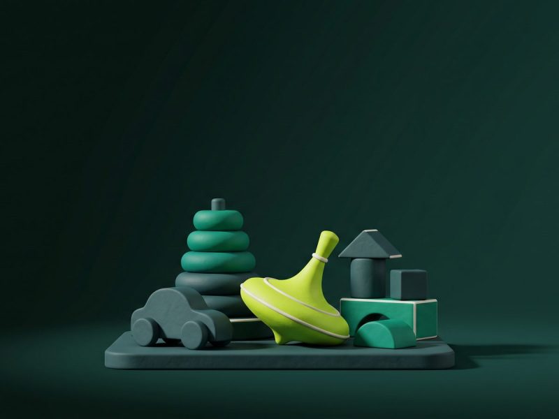 Brinquedos de madeira em 3D sobre fundo verde-escuro, com um pião verde-limão em destaque